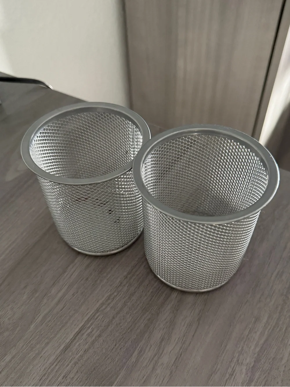Set of two metal pen and pencil holders